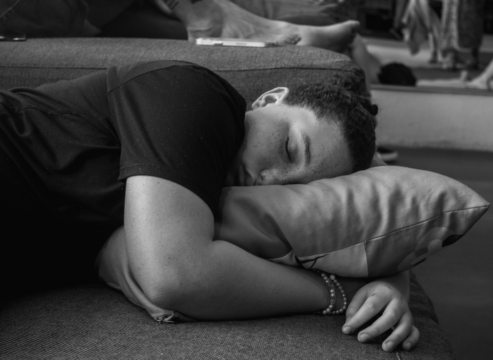 A man resting and sleeping, illustrating that muscle is built during recovery, not just during training