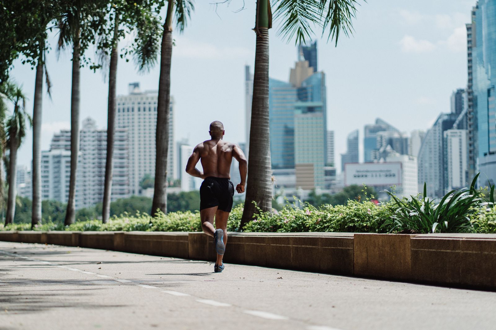 A person running outdoors, showing the kind of consistent, everyday movement that supports sustainable weight loss