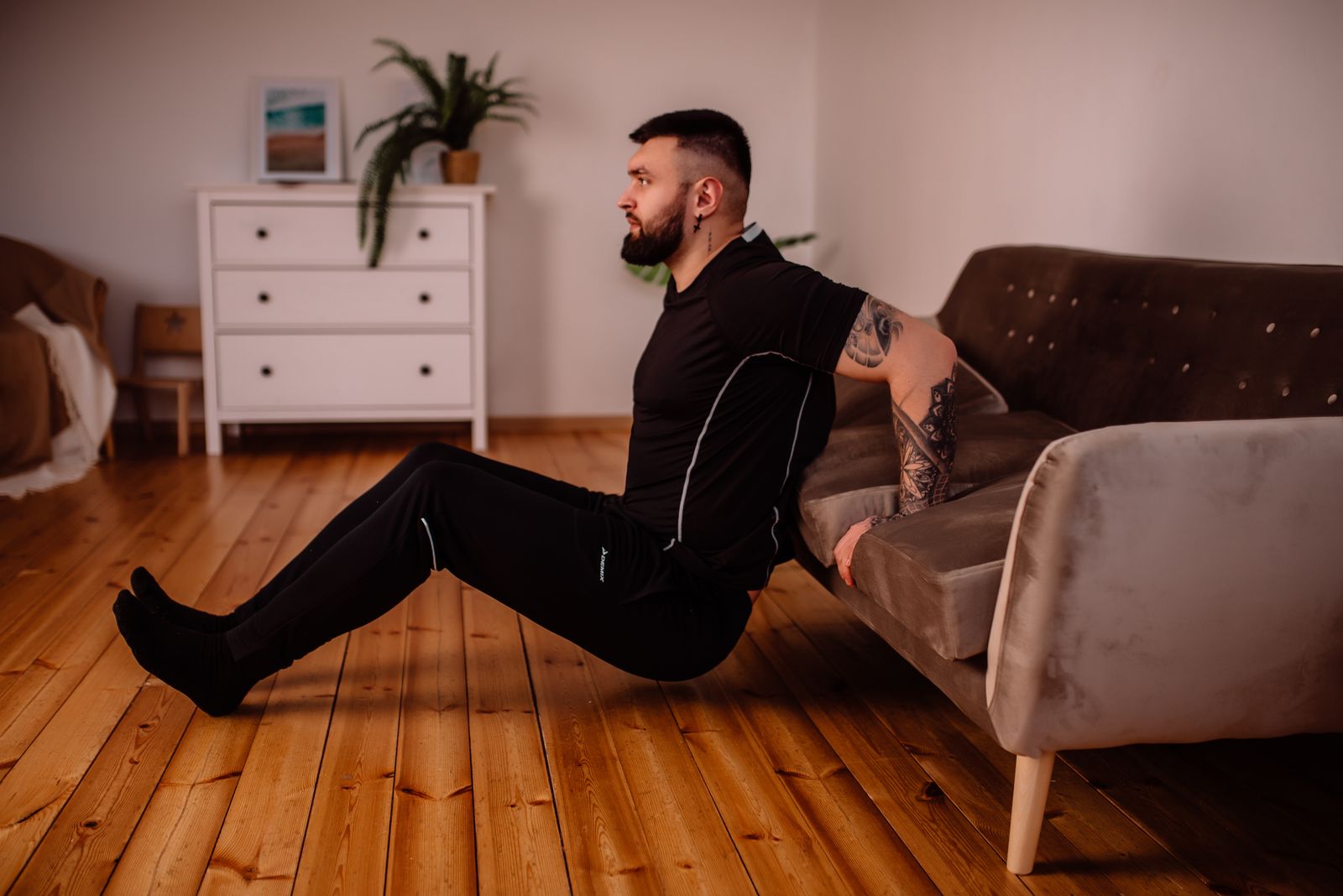 Person doing a bodyweight workout at home with no equipment