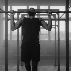 Person doing a pull-up on a bar