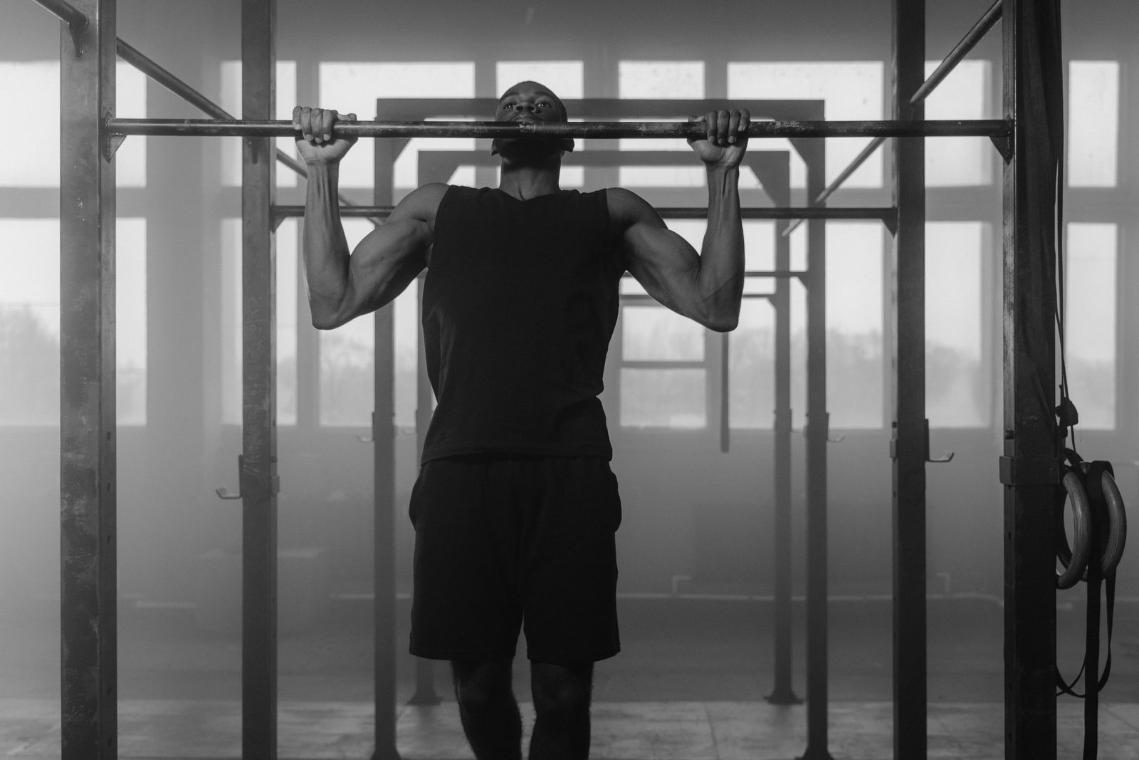 Person doing a pull-up on a bar