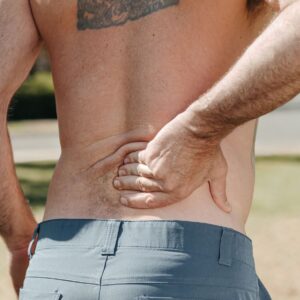 Person doing a gentle lower back stretch at home