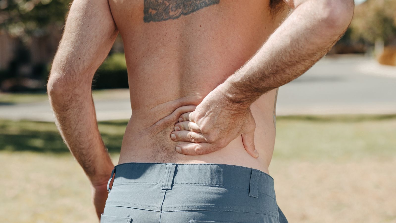 Person doing a gentle lower back stretch at home